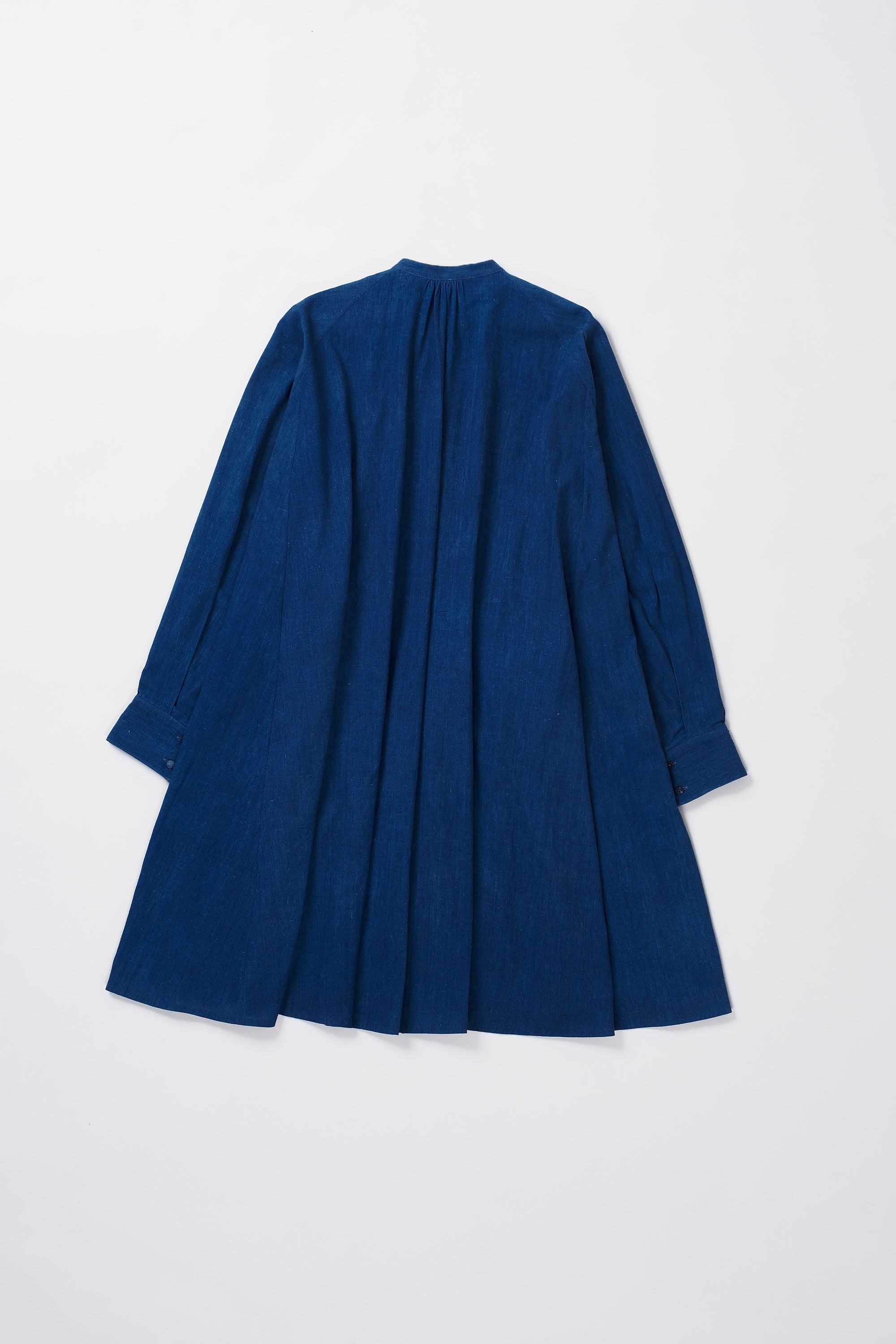 A back shot of a medium indigo cotton dress