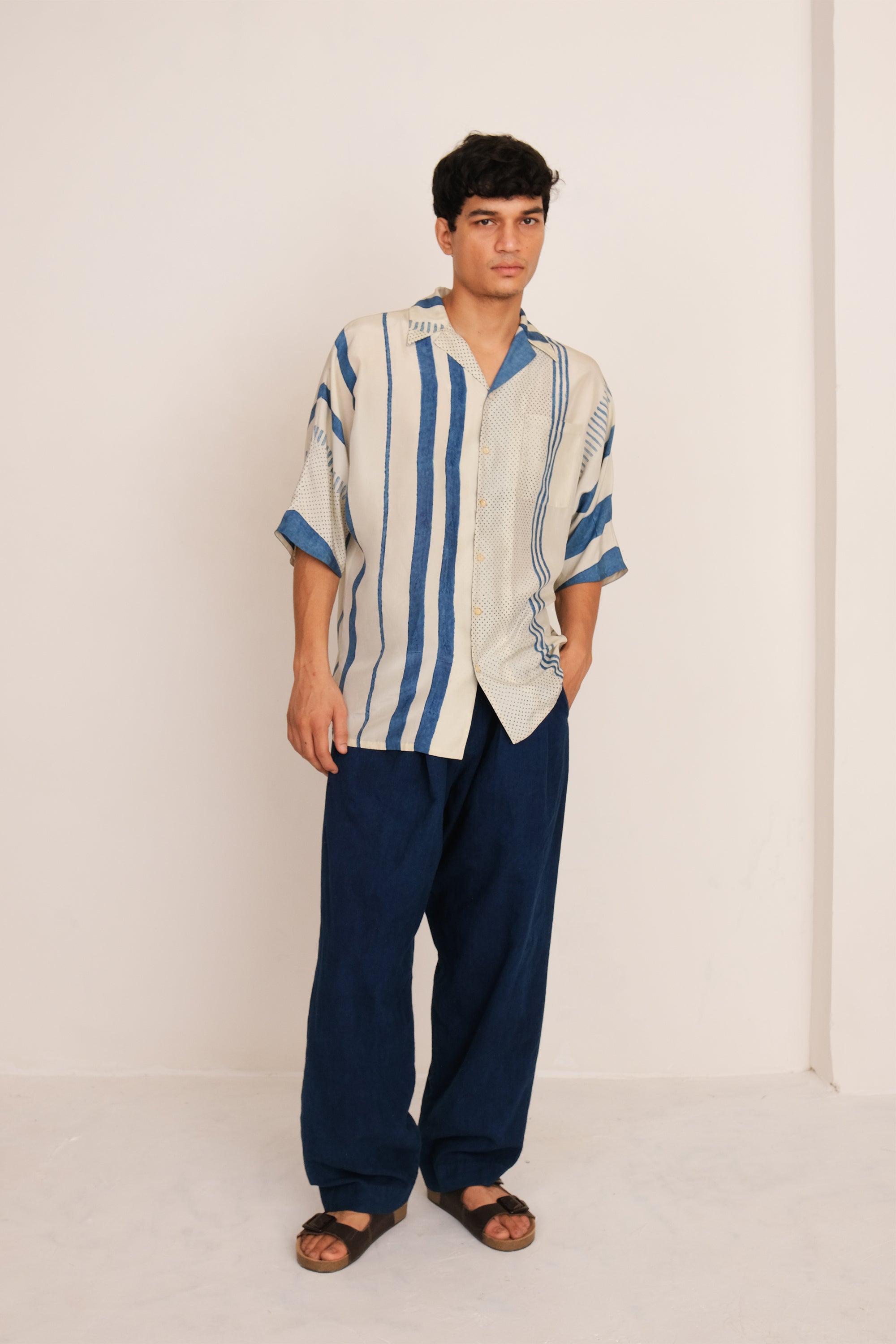 A man wearing ecru shirt