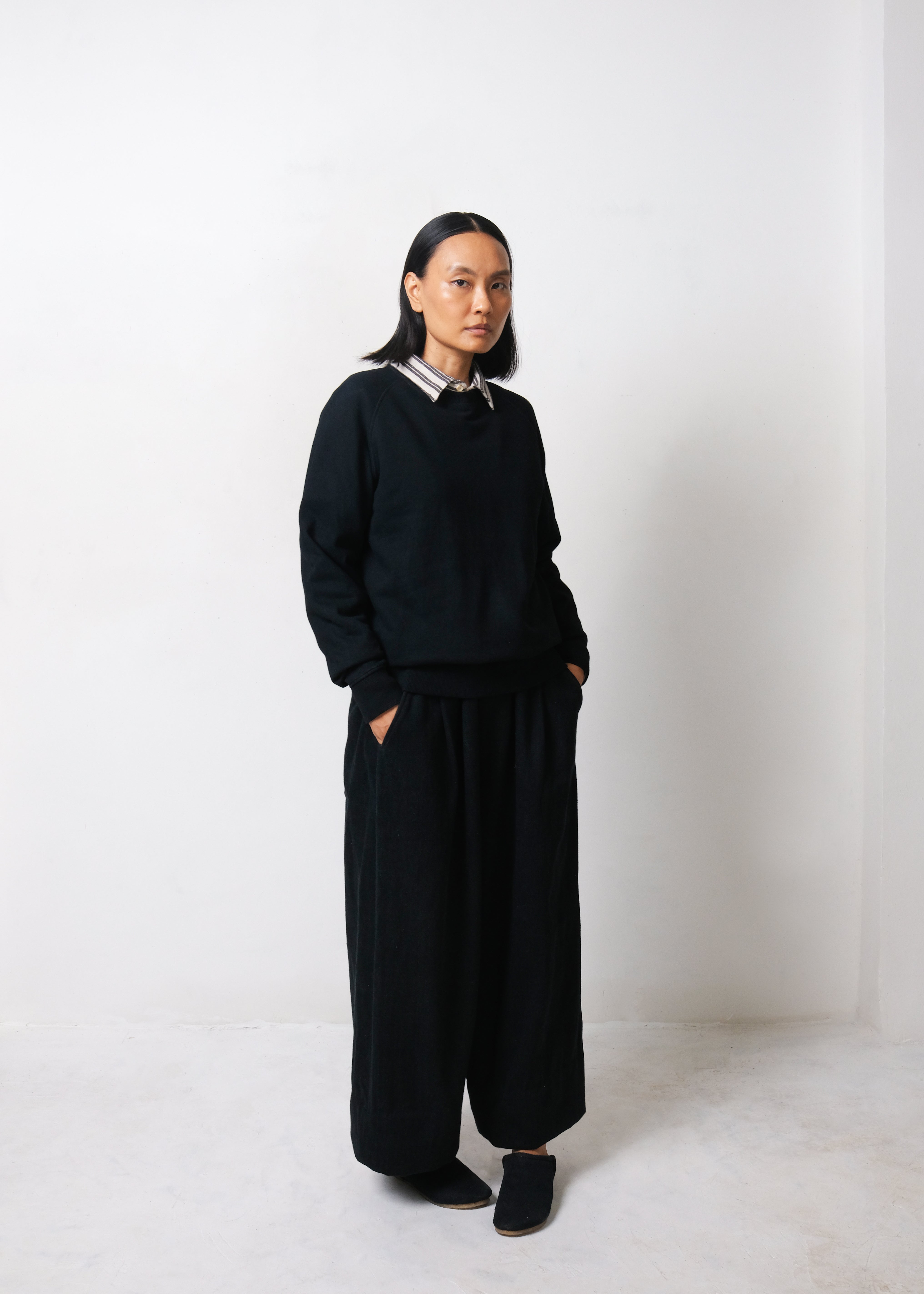 A woman wearing black sweatshirt