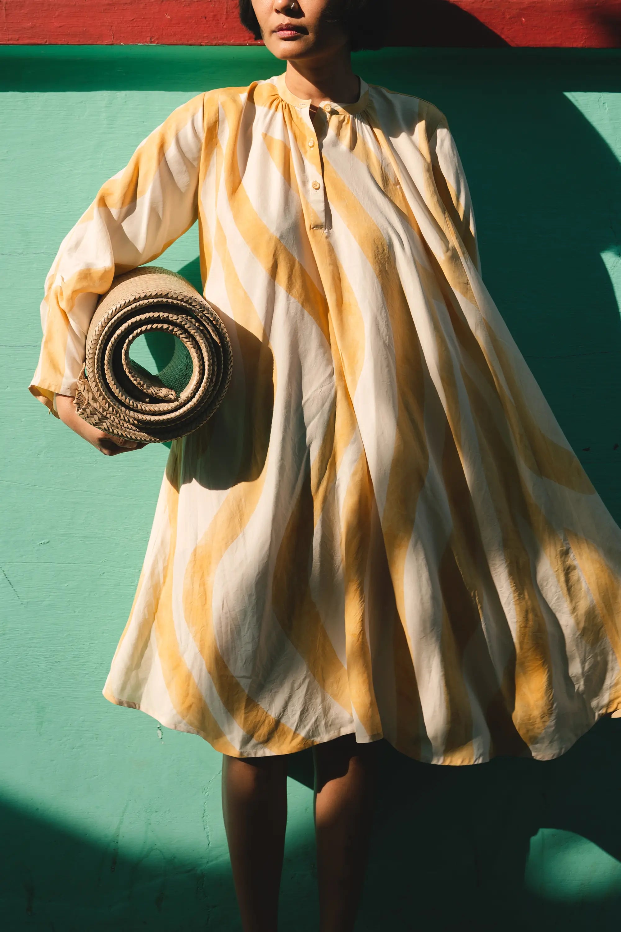 A women wearing mango yellow silk dress