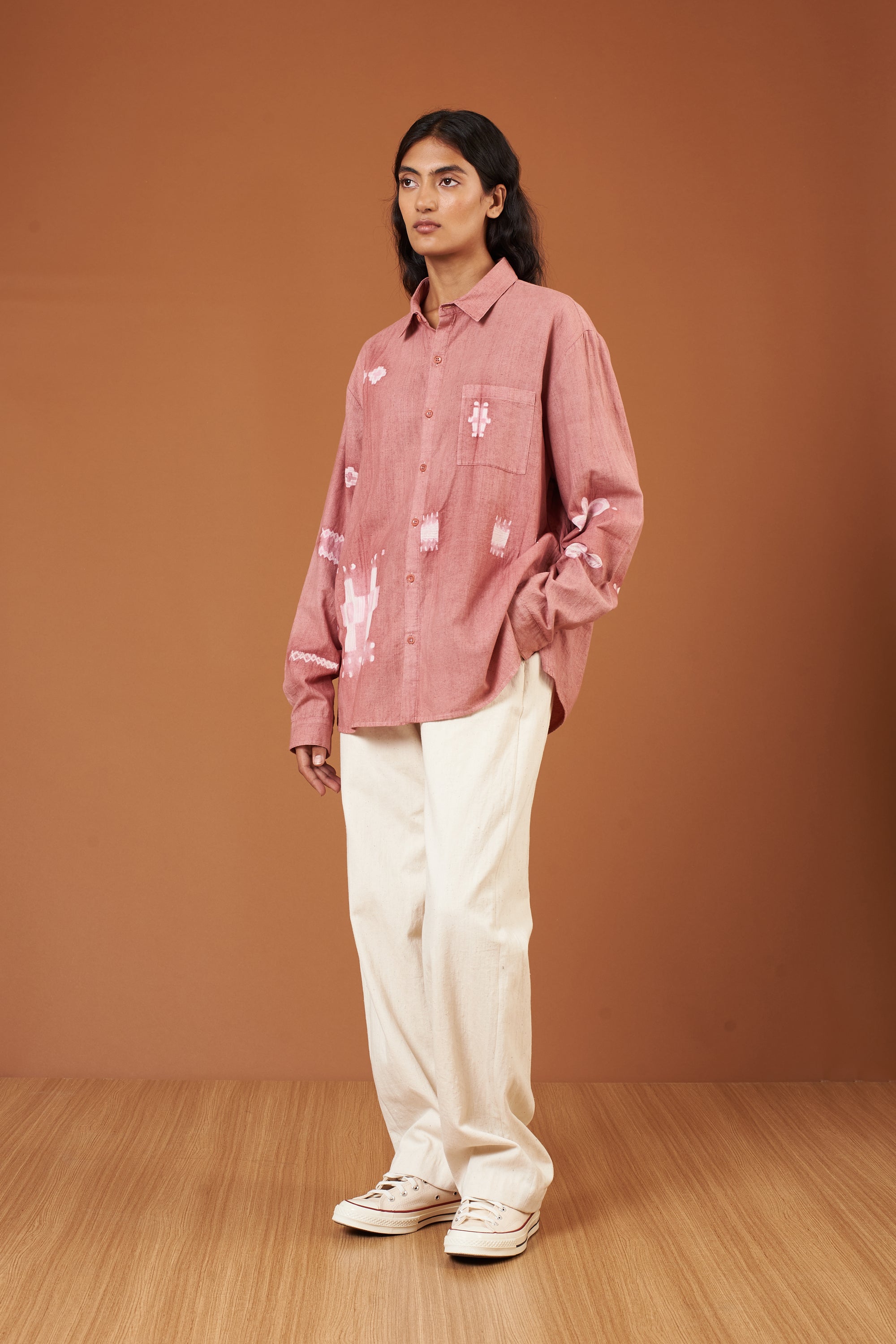 A woman wearing ecru pant