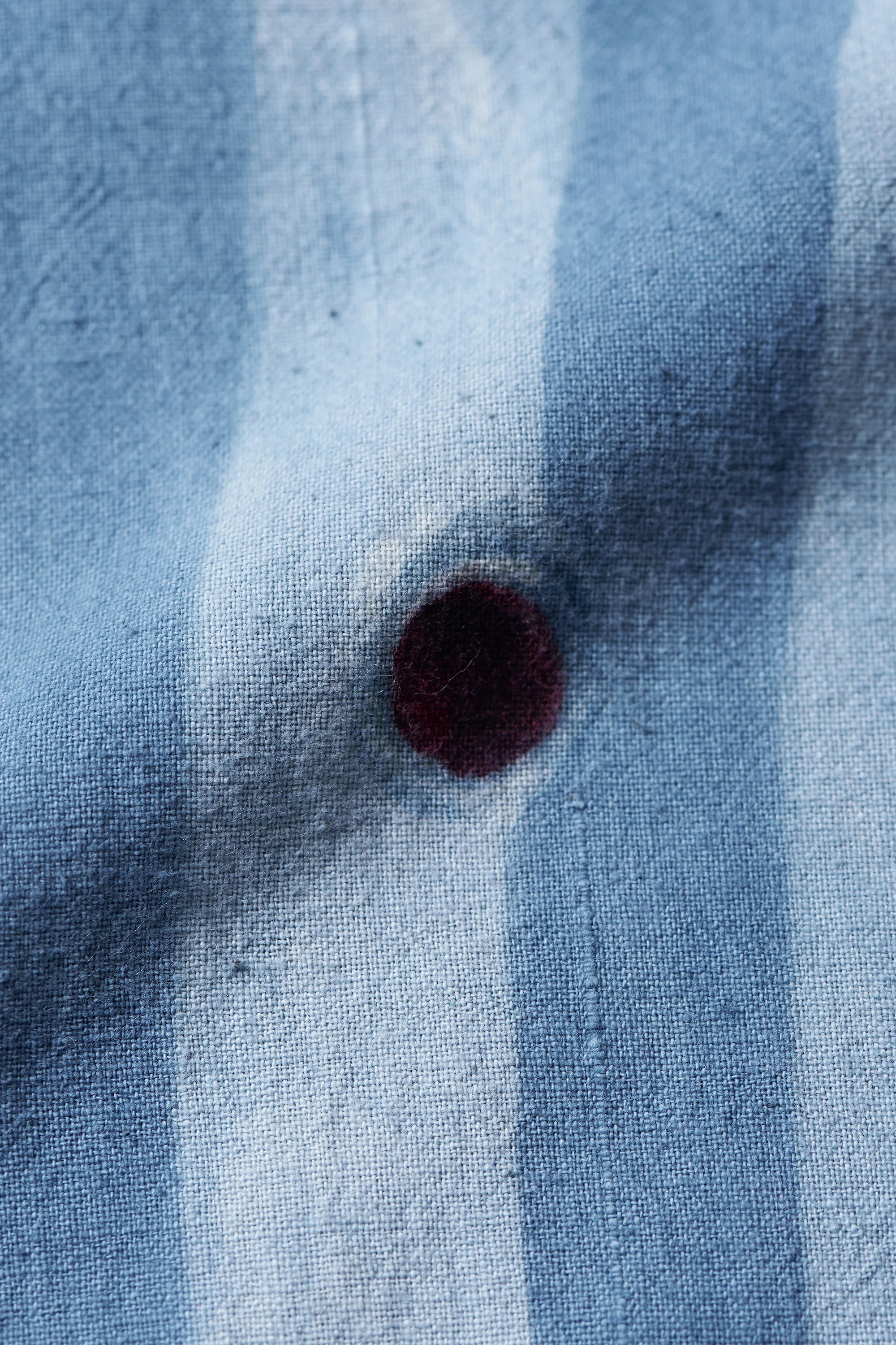 Fabric close-up with hand-painted circular motifs