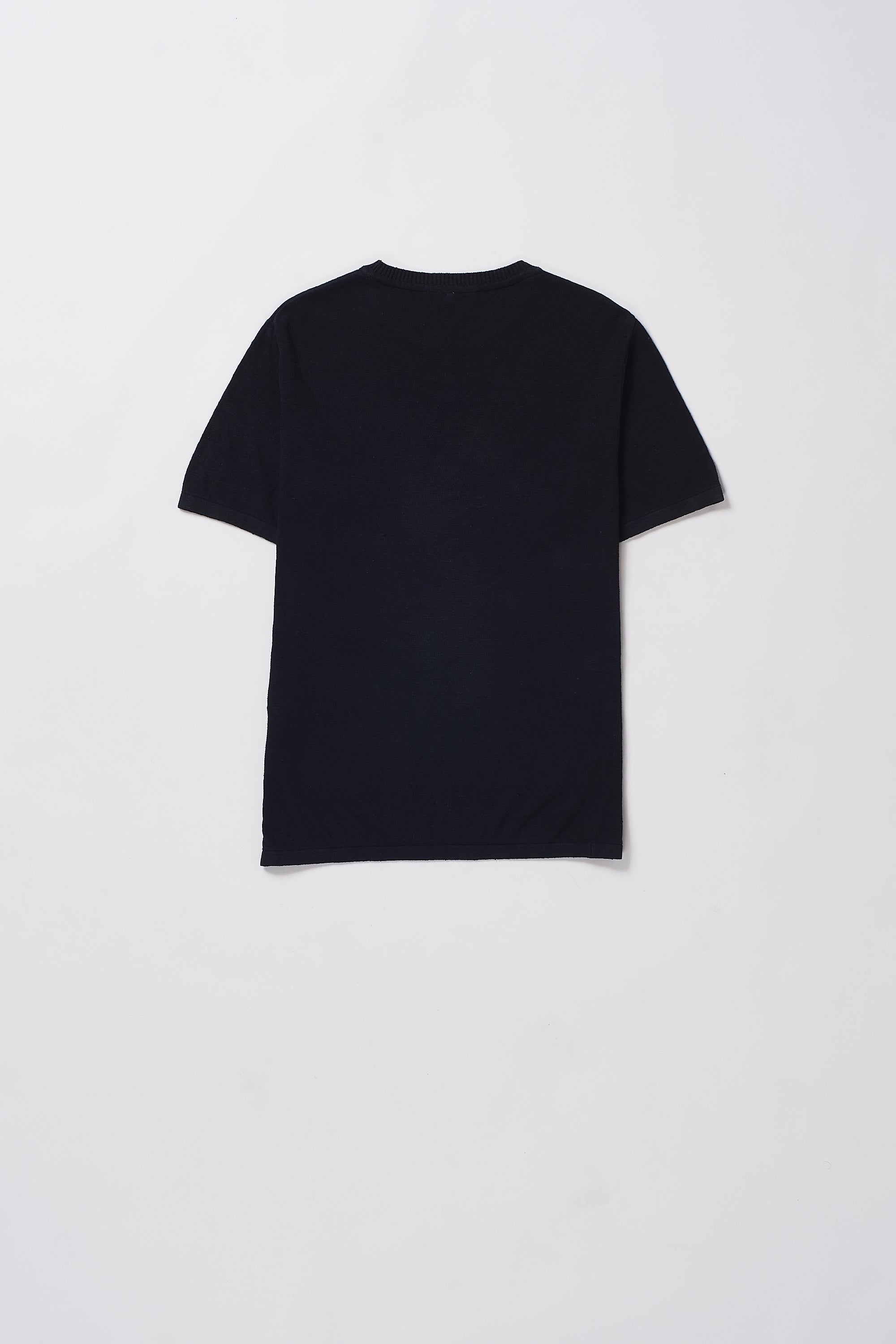 Back shot of t-shirt on a grey background