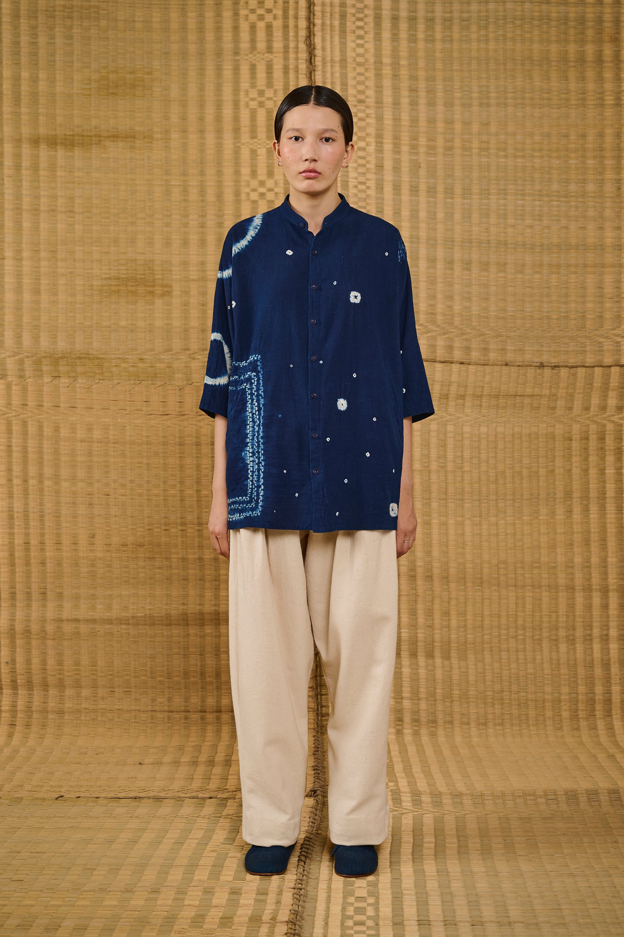 A woman wearing indigo shibori shirt