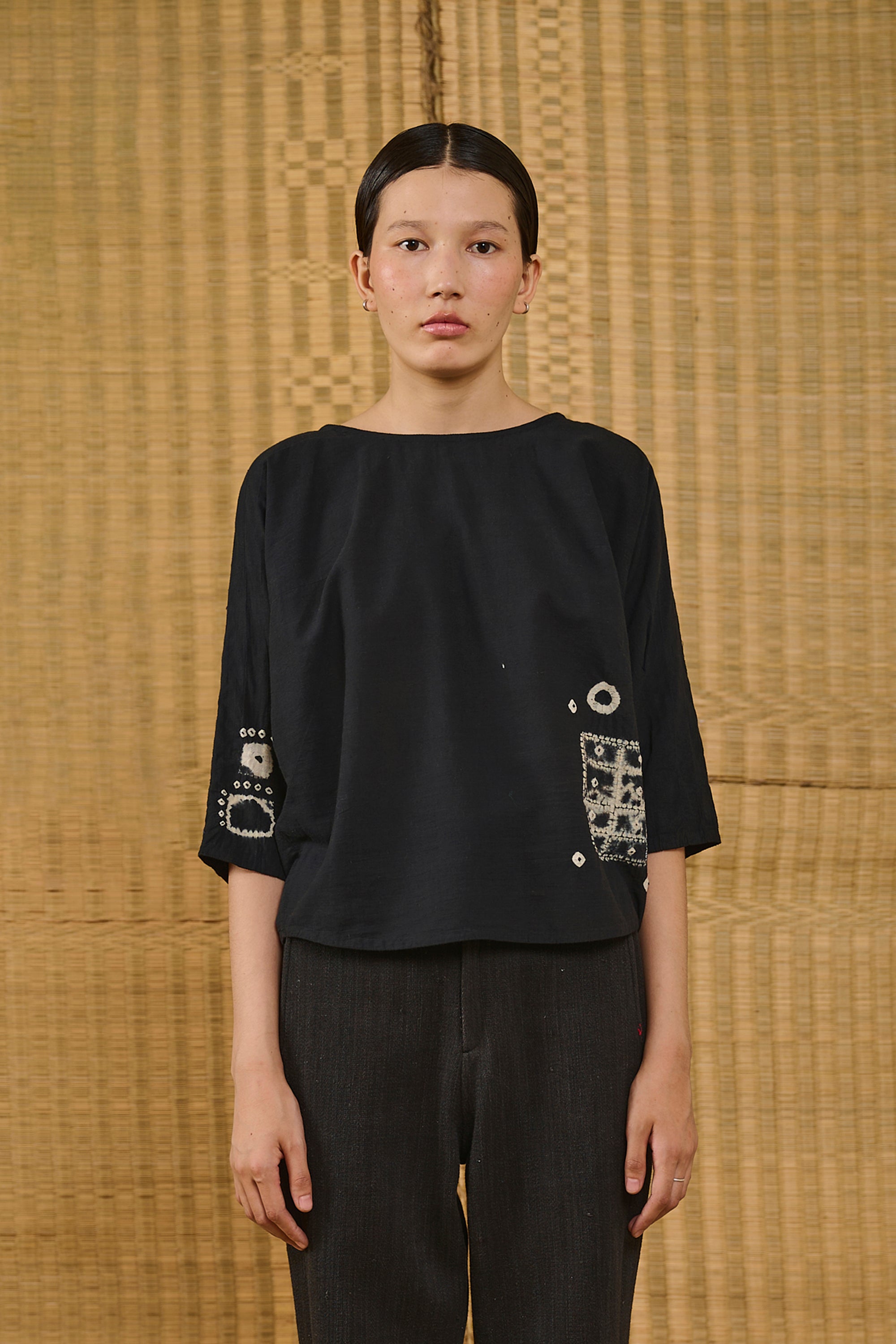 A woman wearing black top