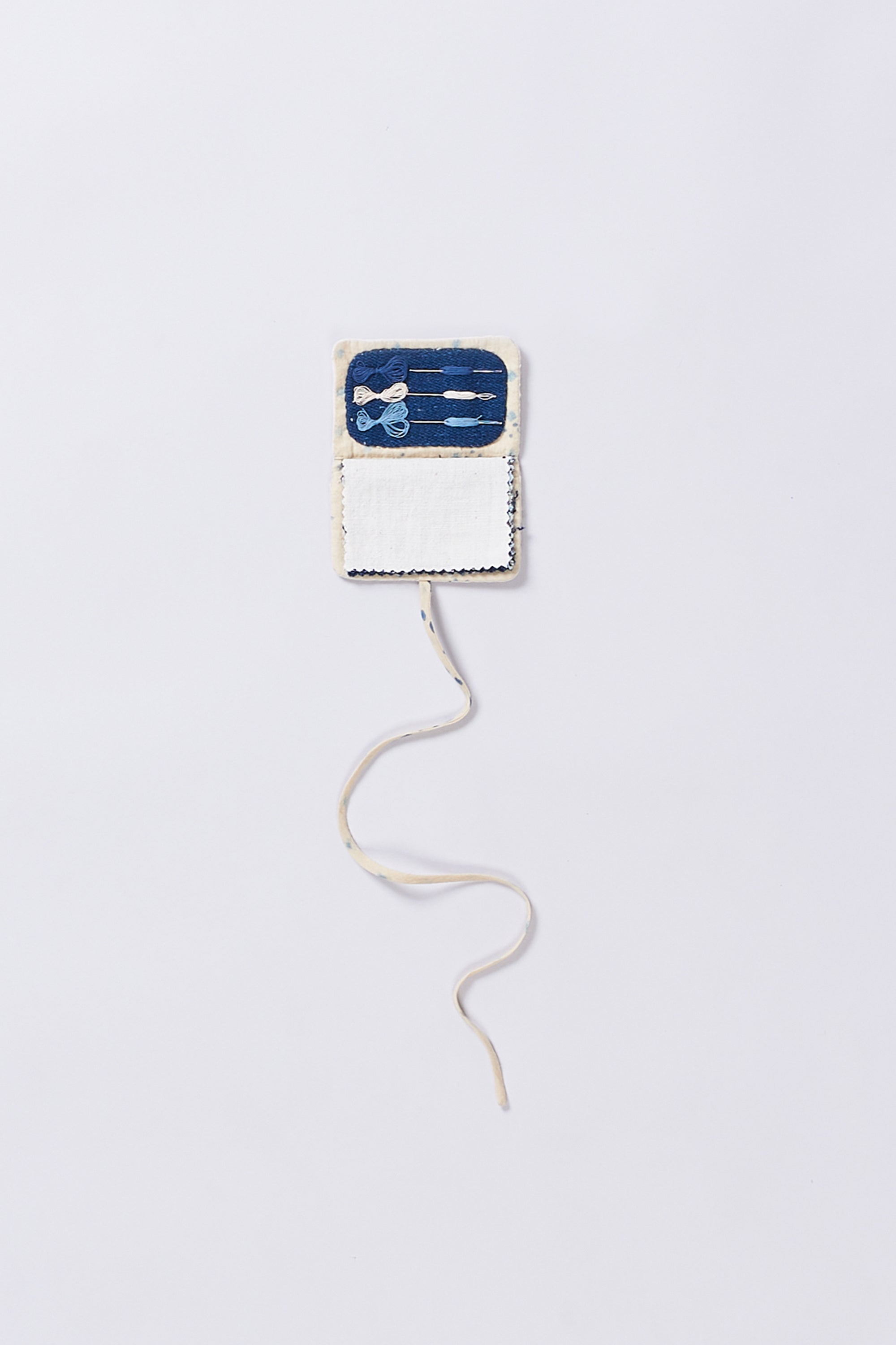 Open ecru sewing kit