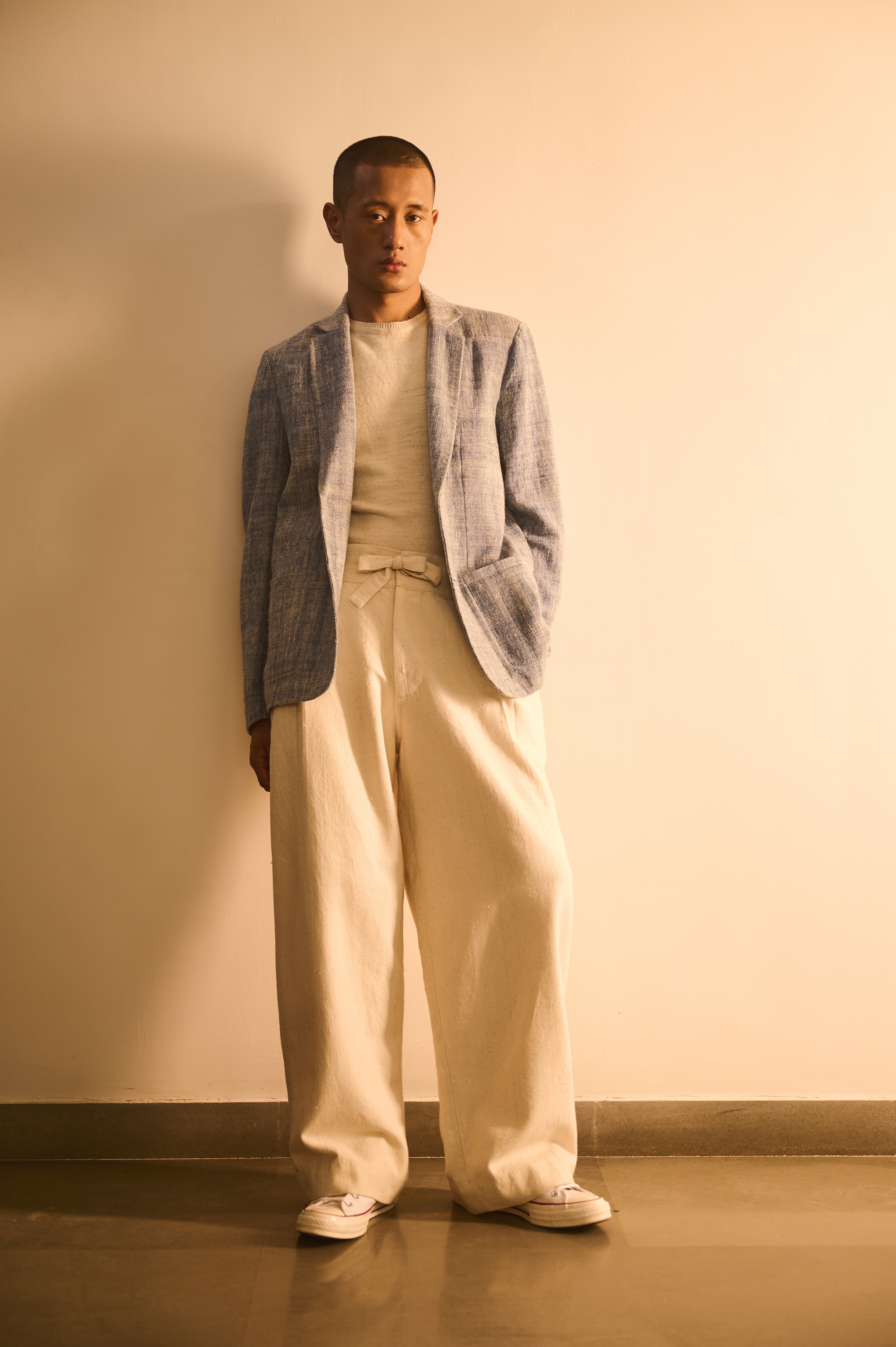 A man wearing medium indigo cotton jacket