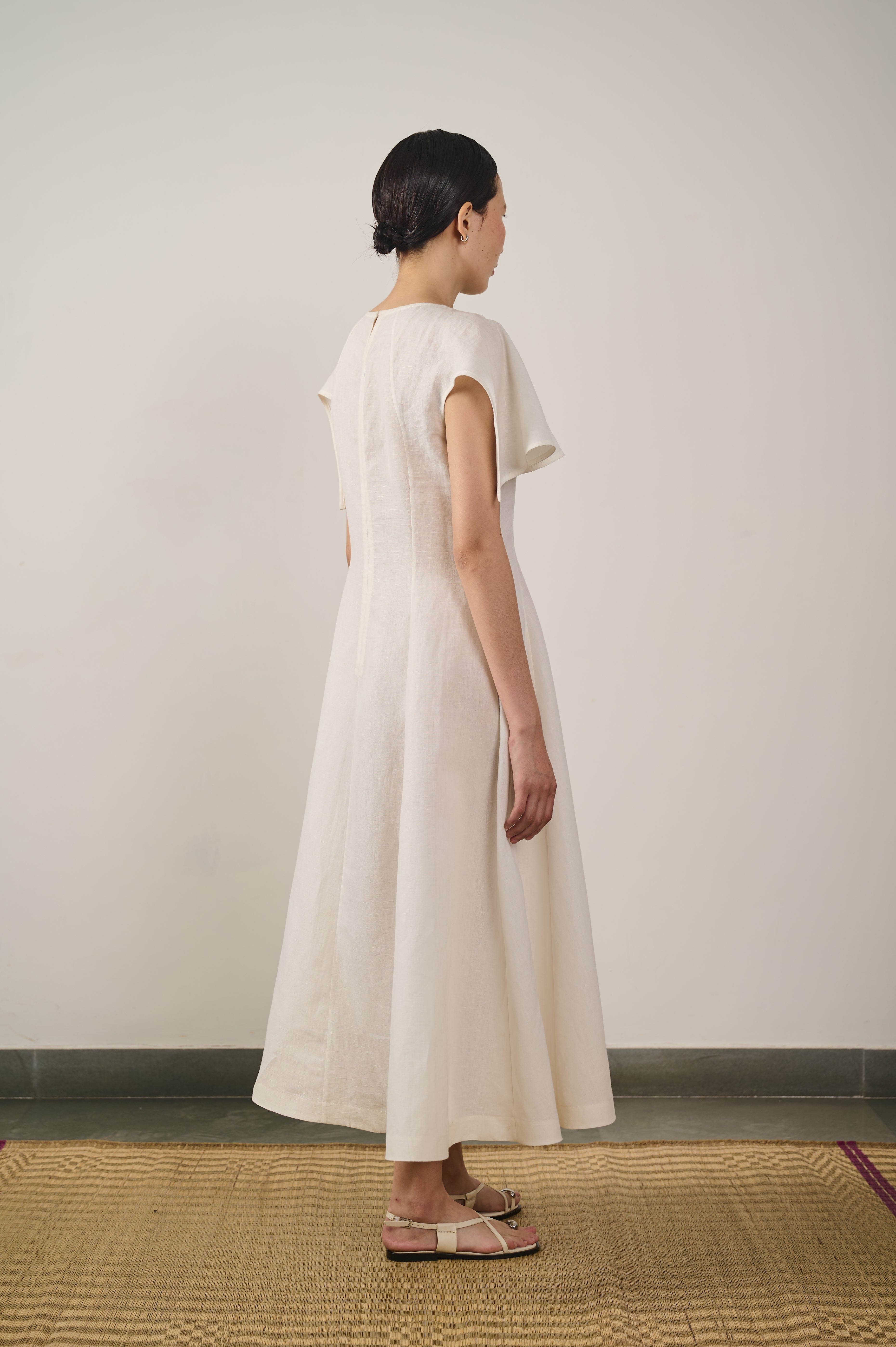 Back image of linen flared dress in ecru