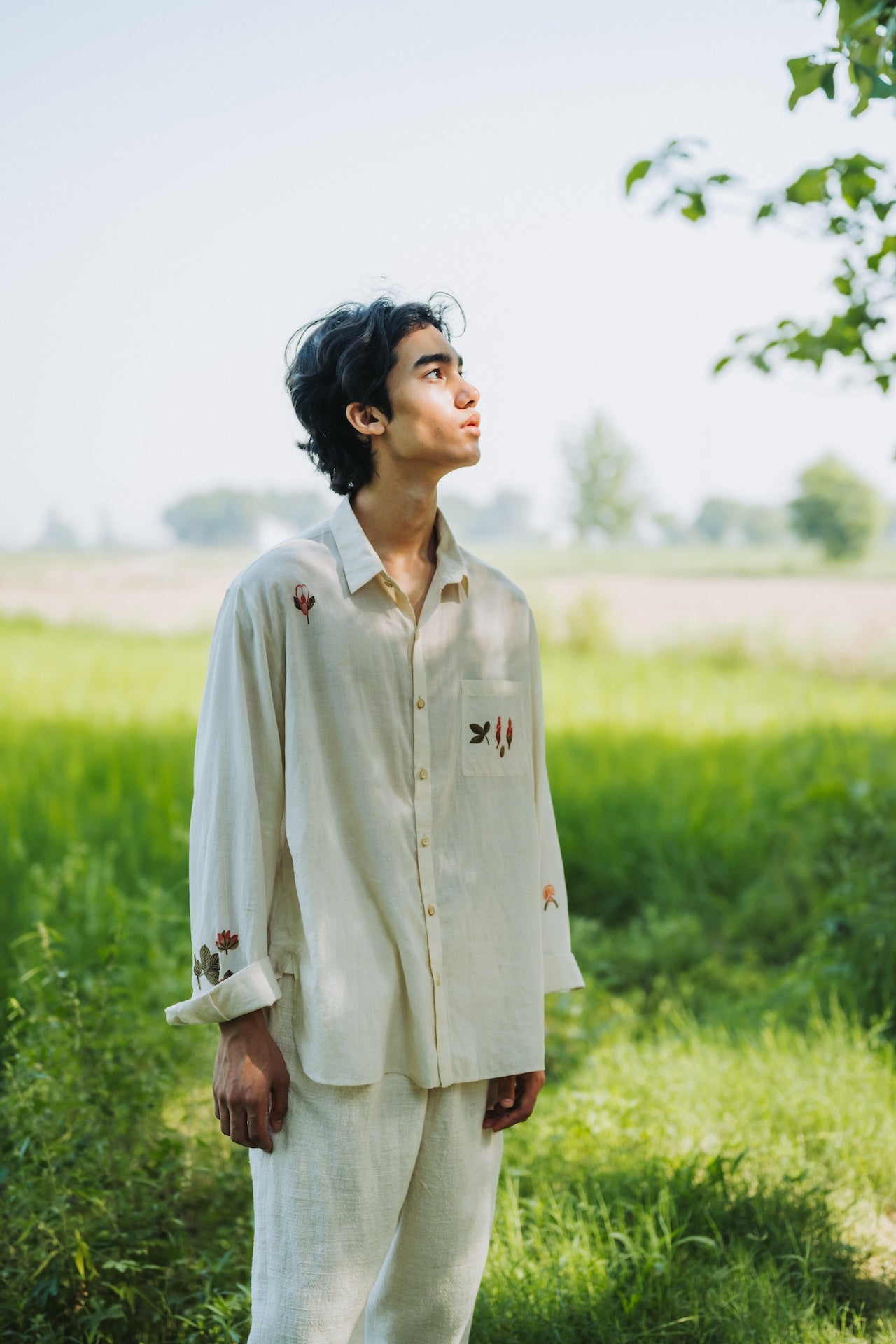 A man wearing ecru cotton hand painted shirt