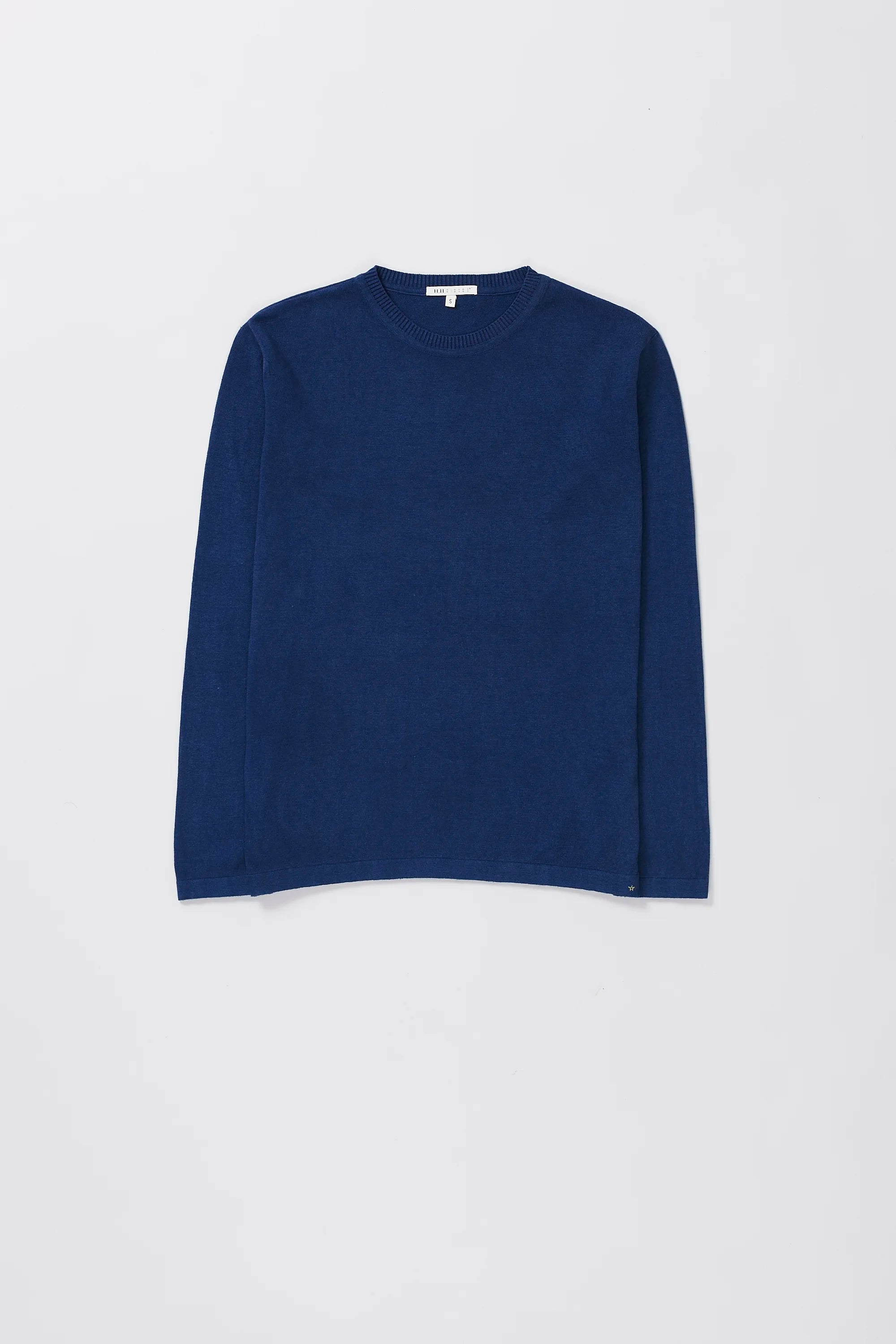 Indigo long-sleeve t-shirt on a grey background