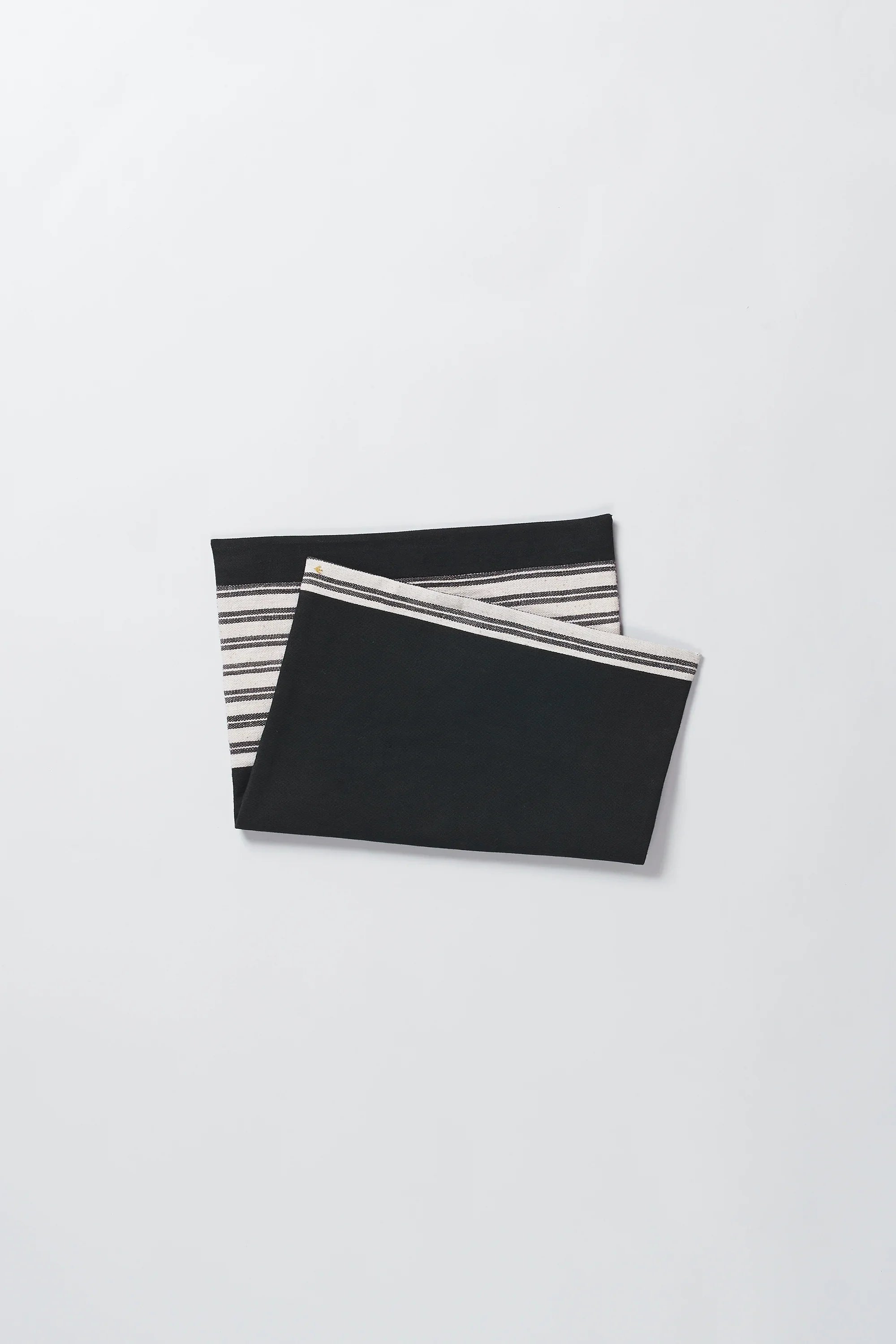 Folded black placemat