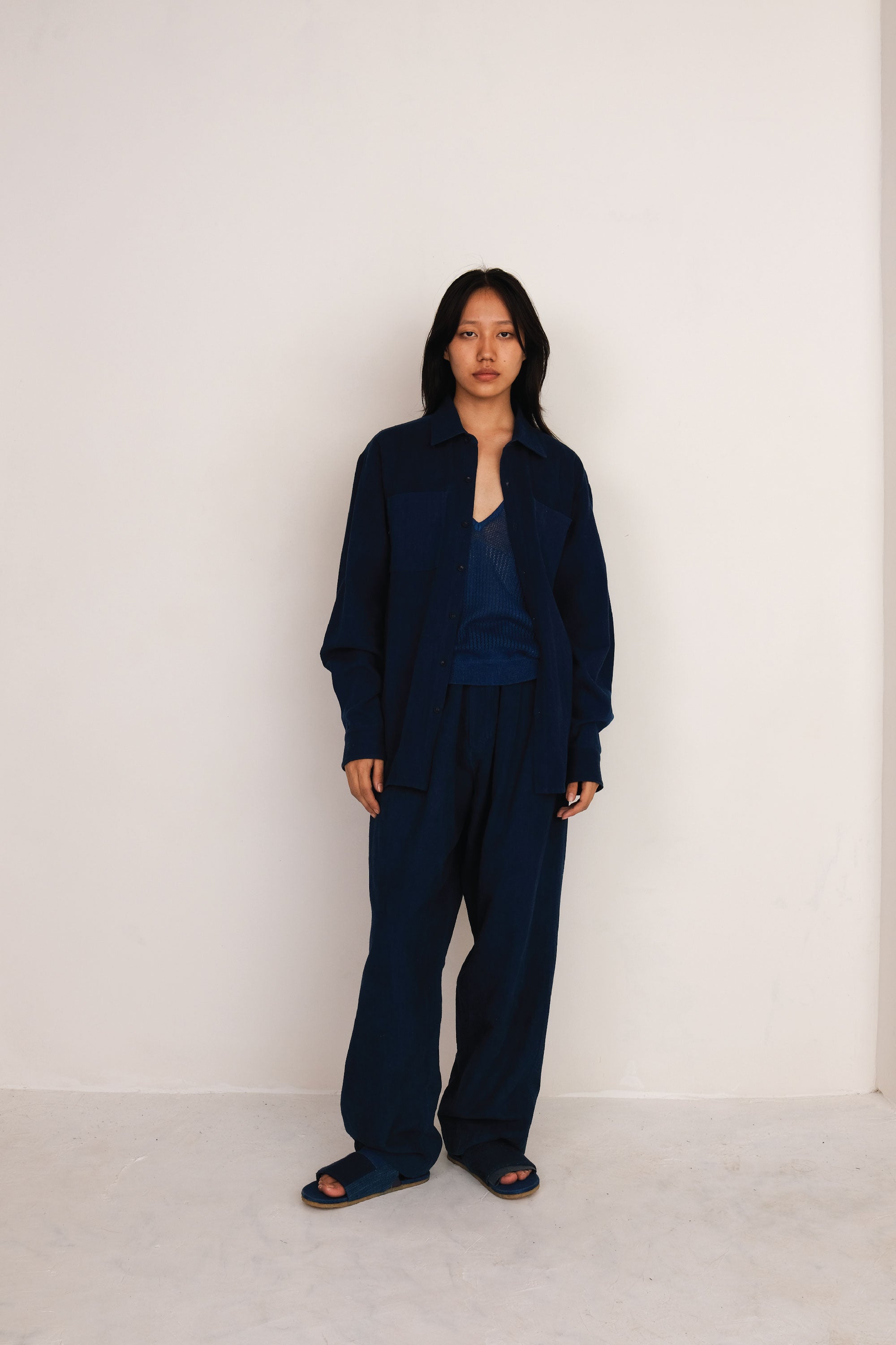 A woman wearing indigo cotton t-shirt