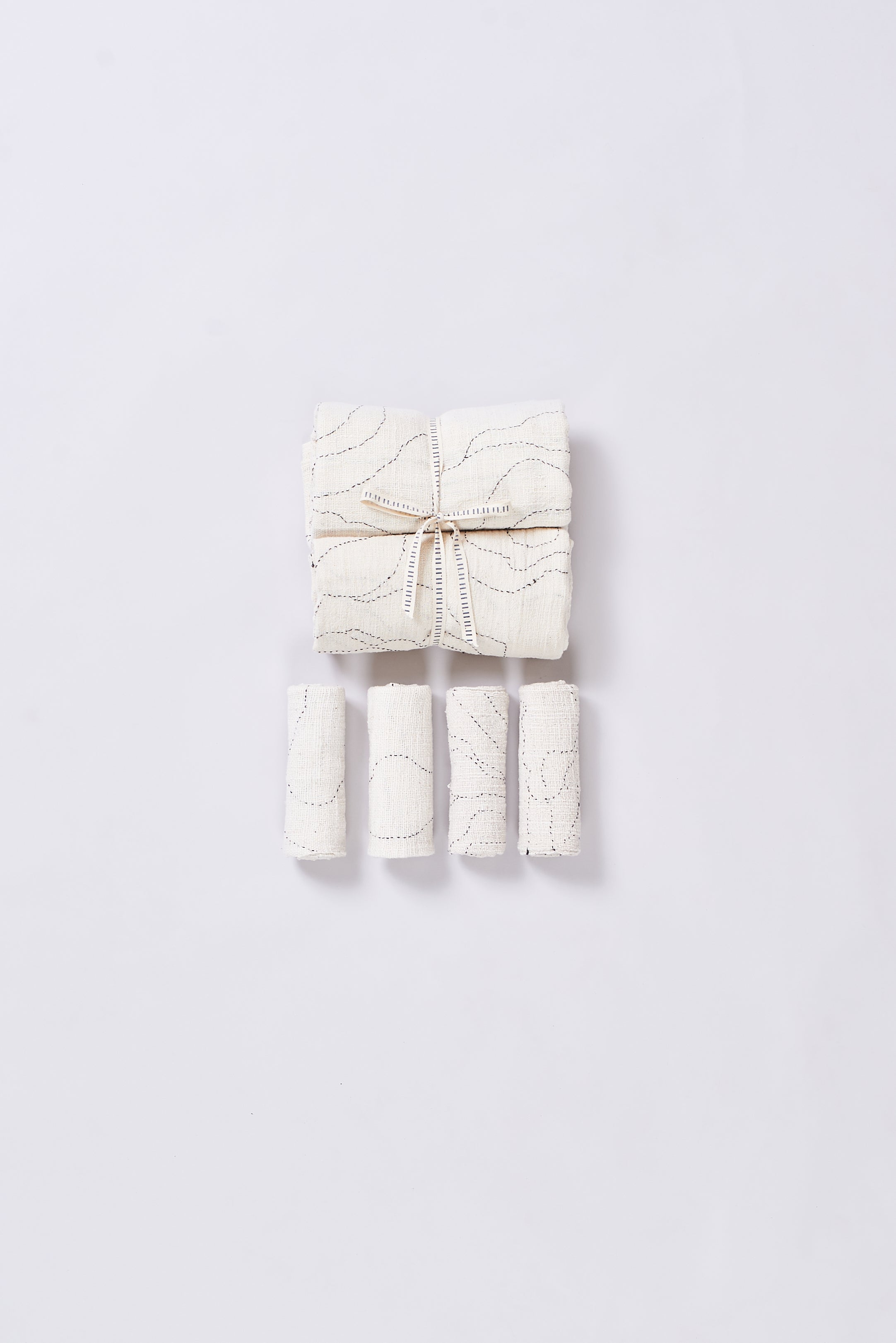 A set of five ecru towel with a white ribbon