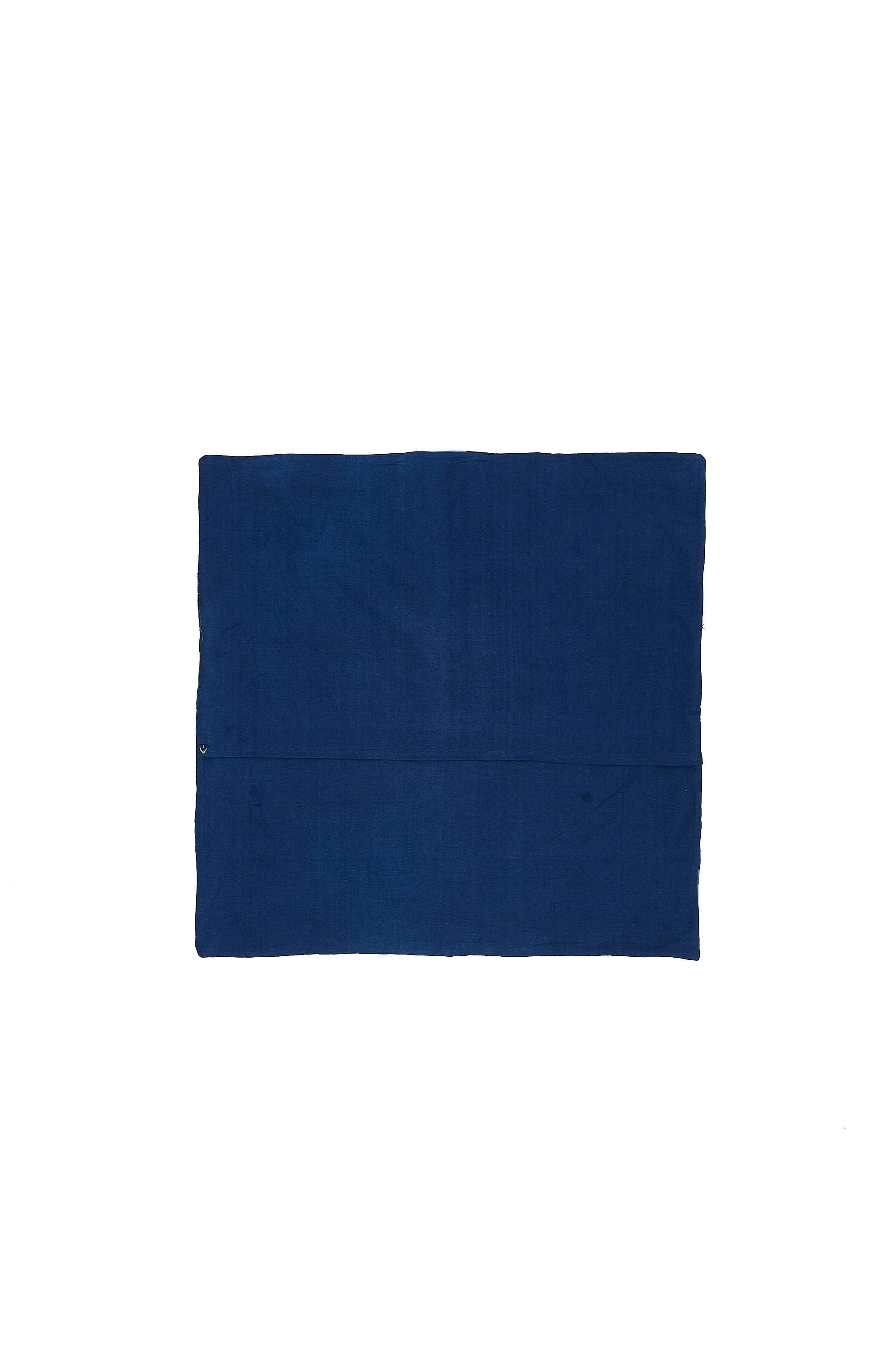 Back image of a patchwork indigo cushion