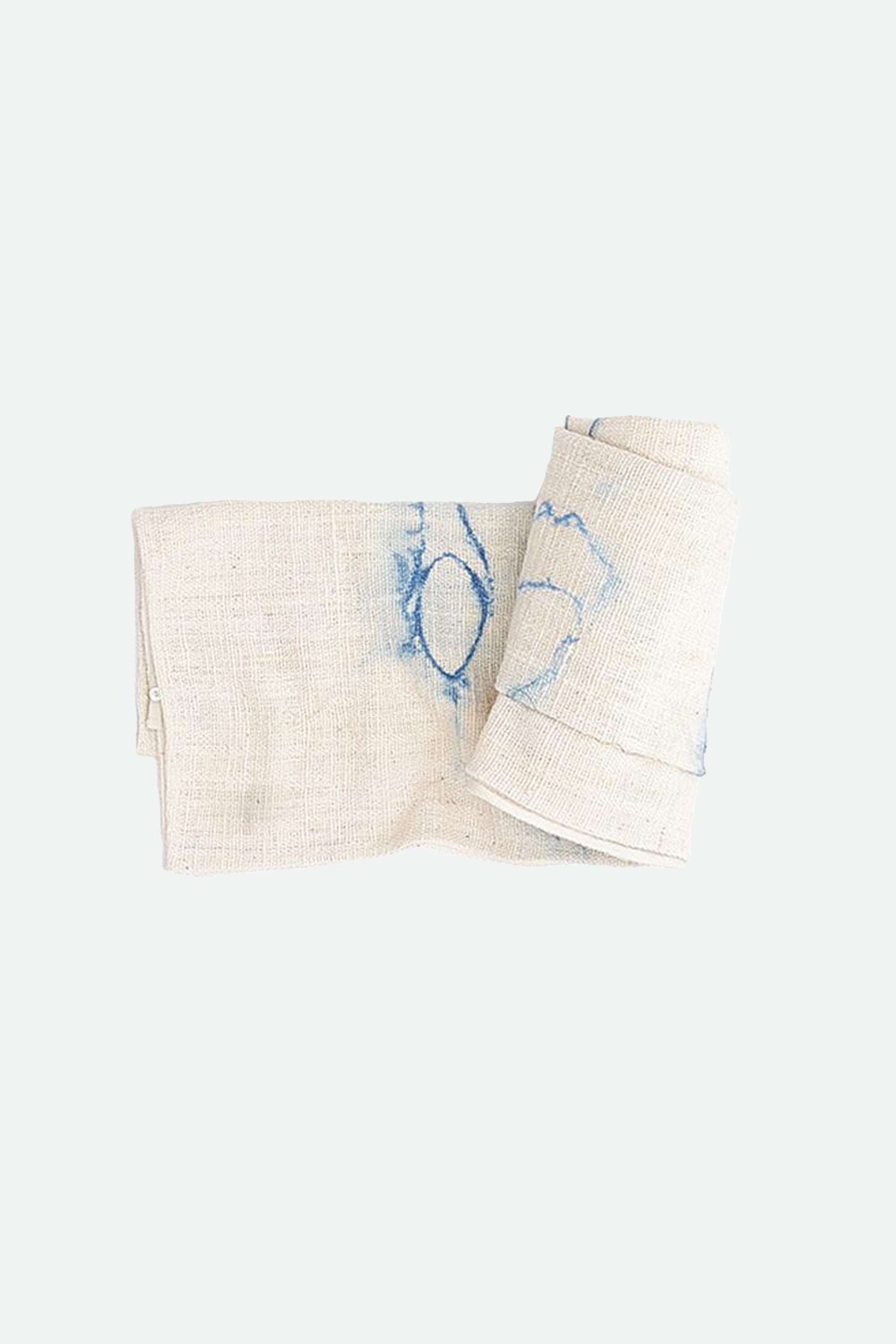 Ecru cotton towel roll on a white background