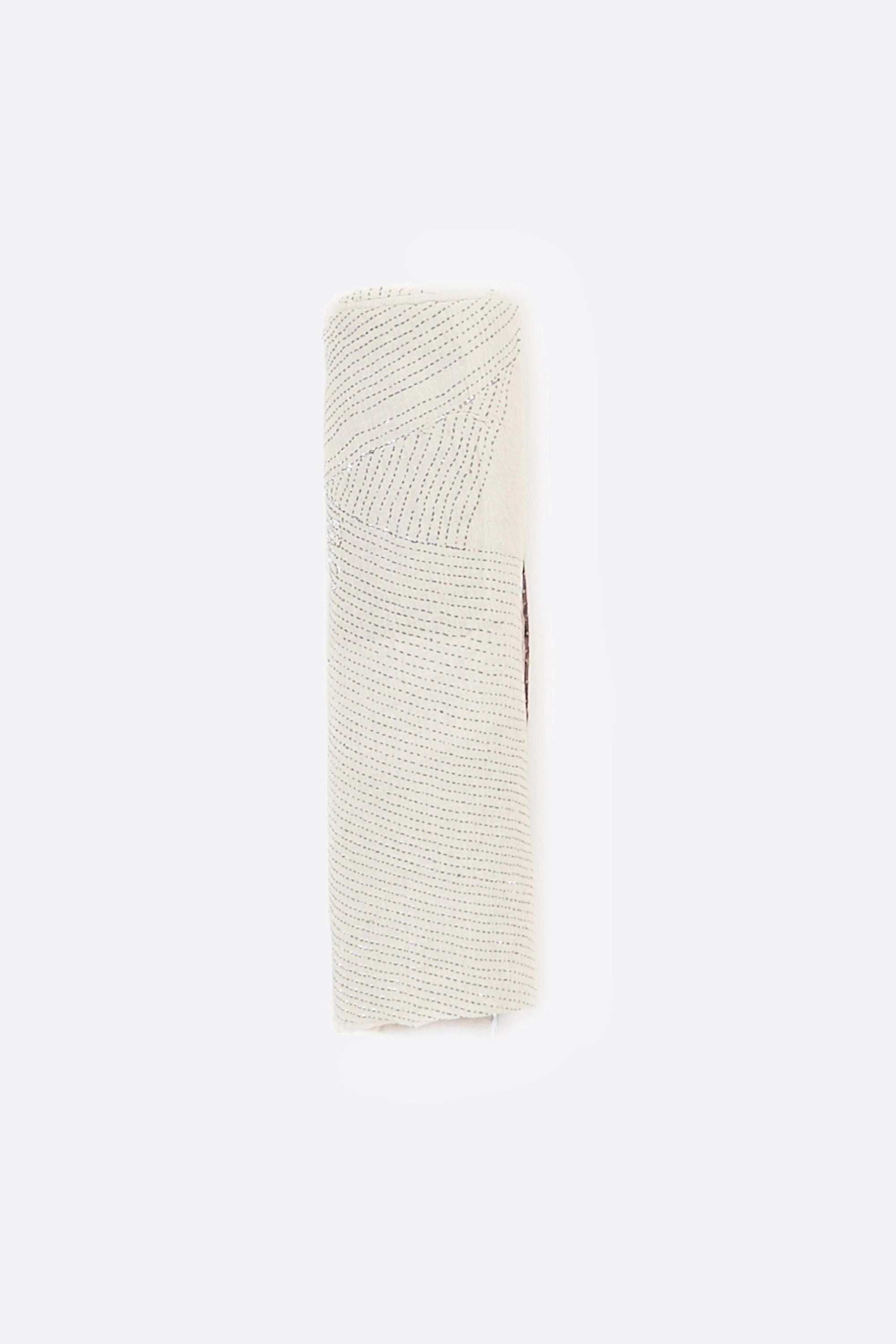 Indigo quilt roll on a white background