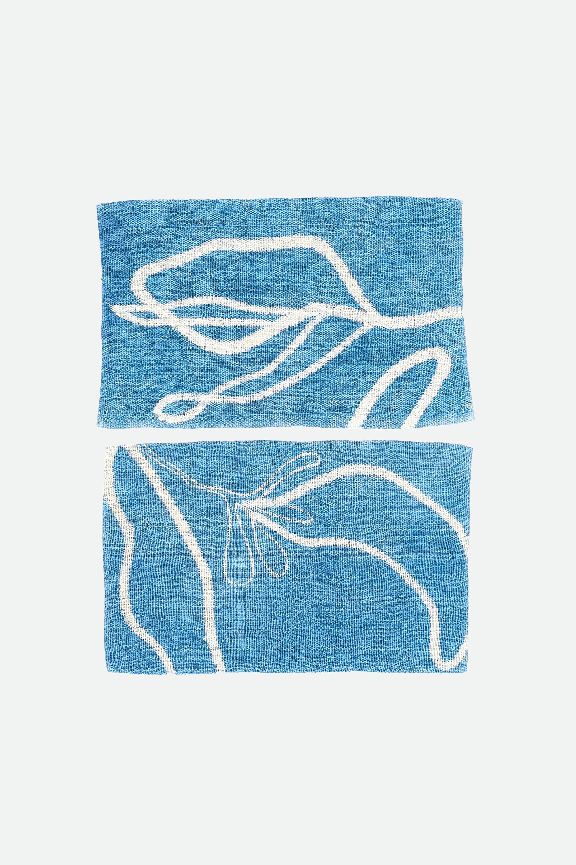 Set of two indigo towel with a hand paint on a grey background