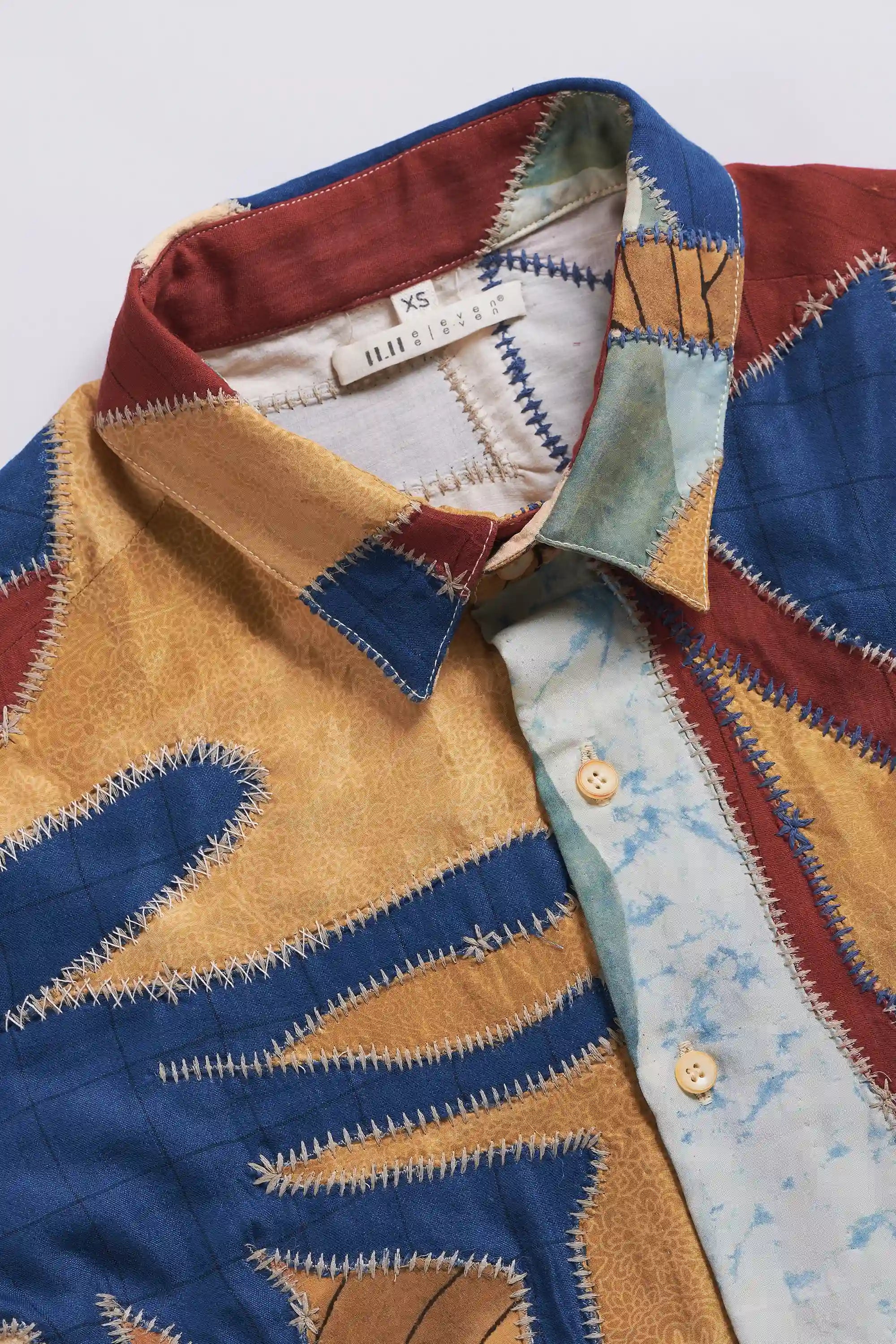 Close-up of fabric with collar and buttons