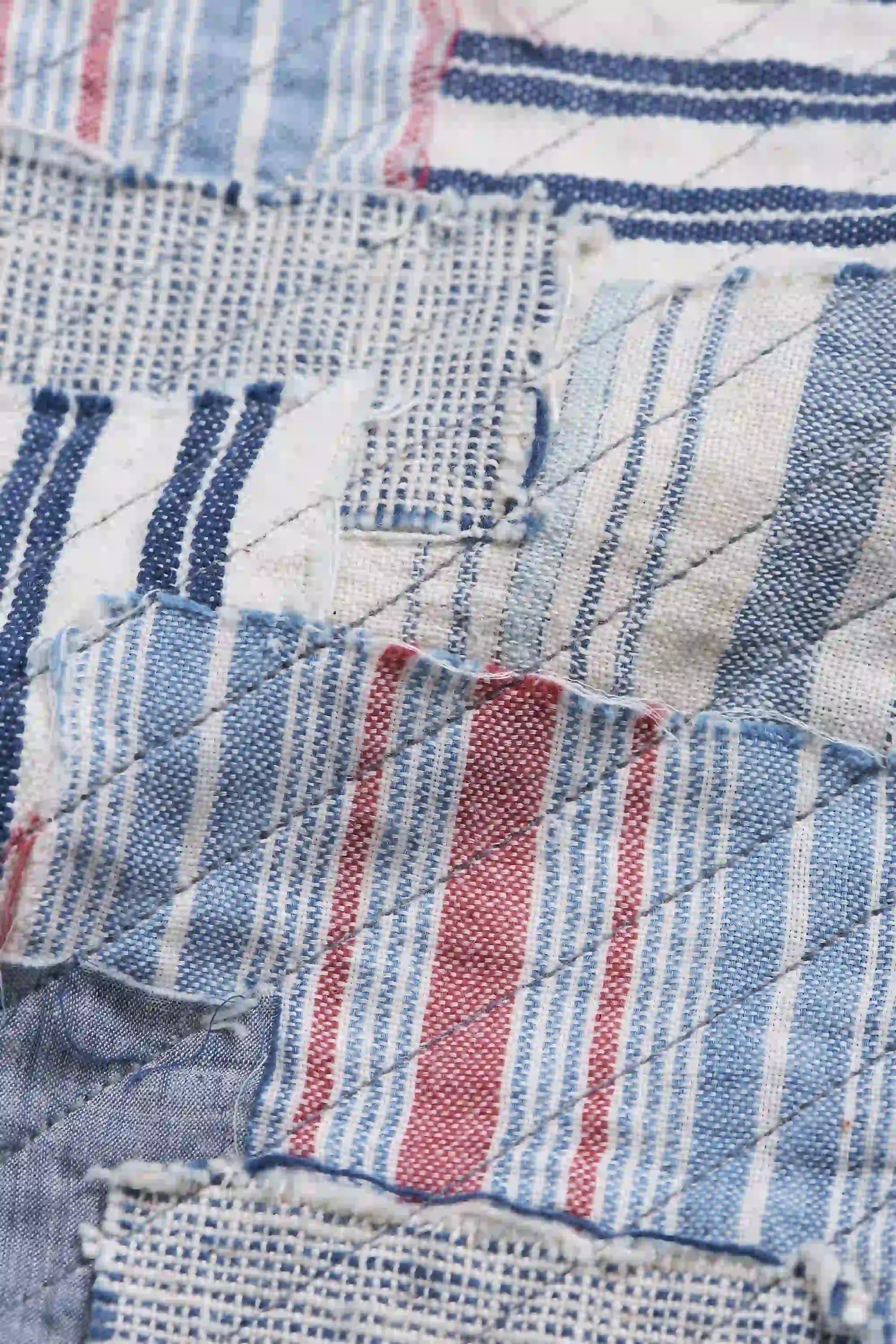 Patchwork denim jacket on a white background