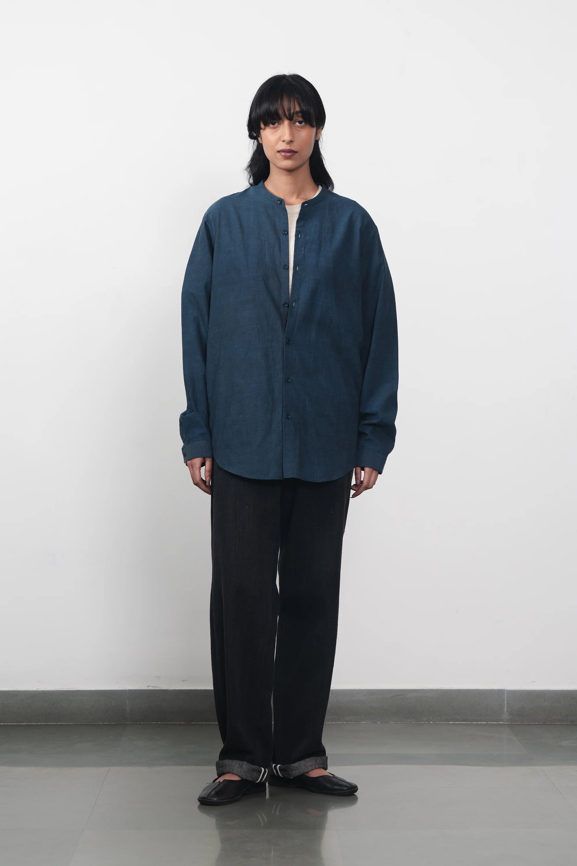 A woman wearing indigo shirt