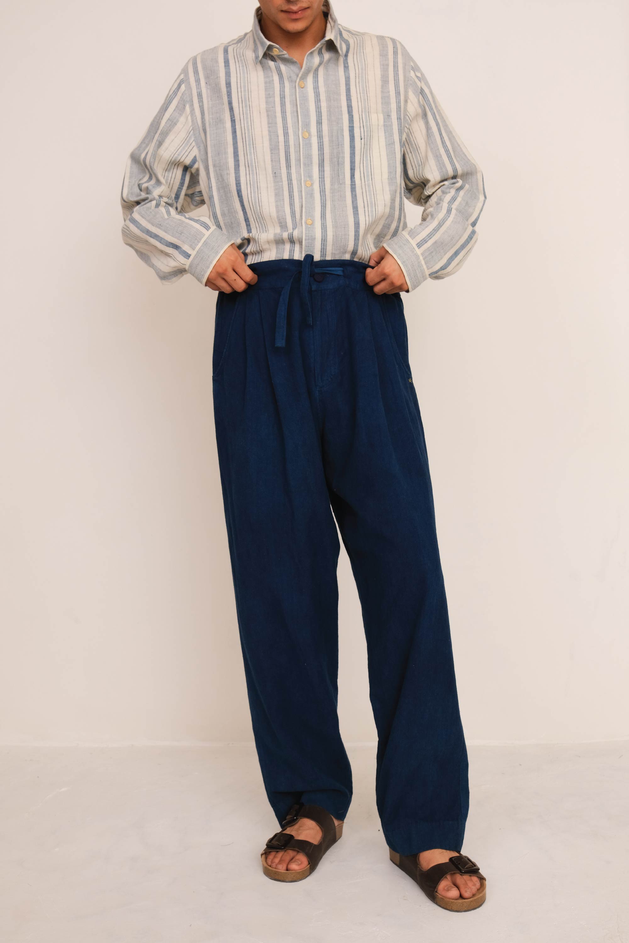 A back shot of a medium indigo pant
