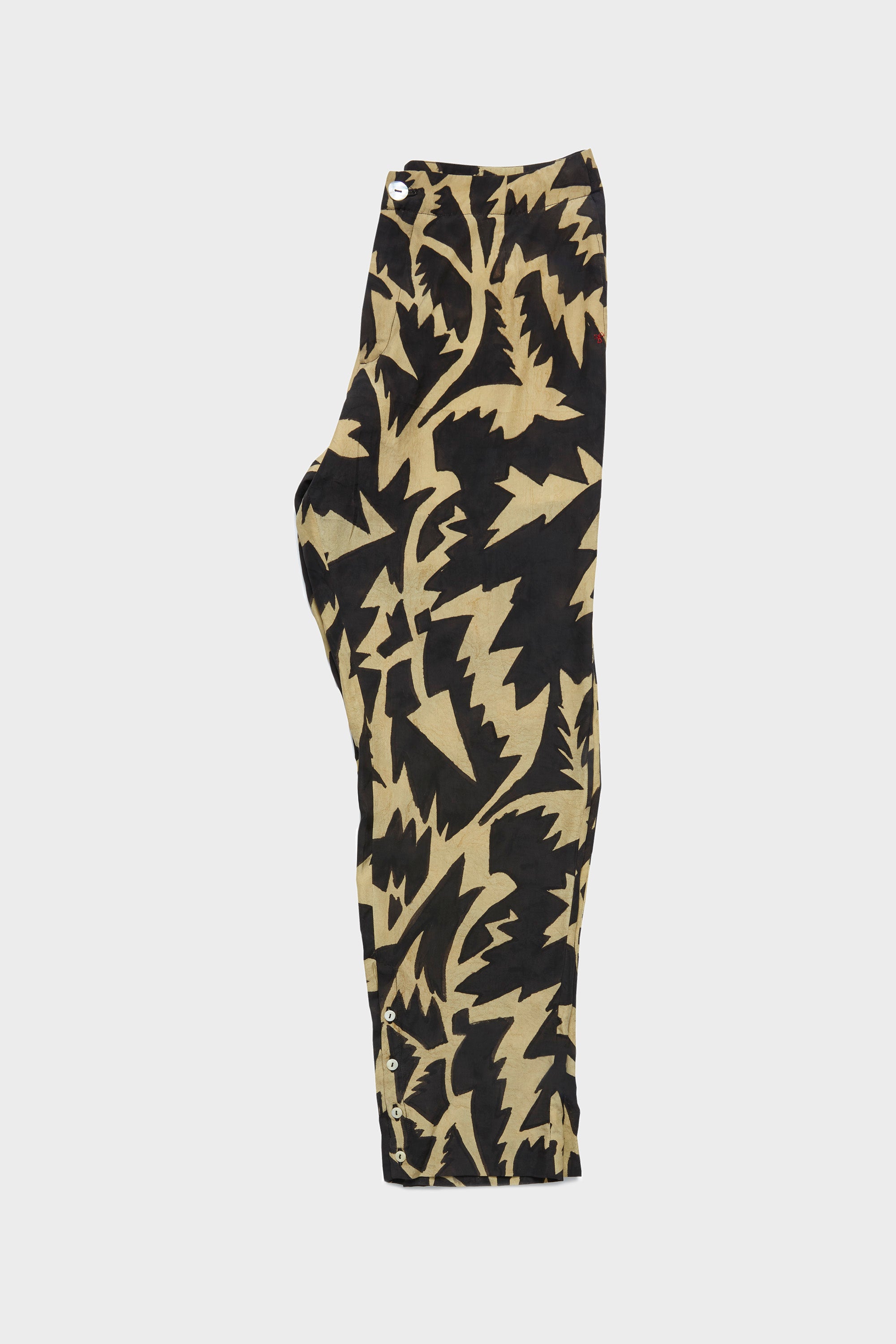 Silk handpainted folded pant on a grey background